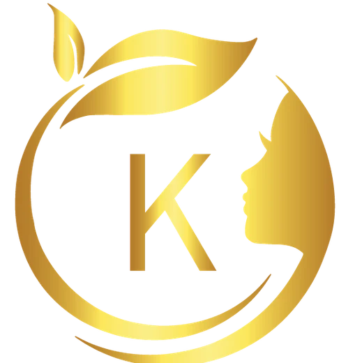 Kiran Kaushik brand mark: a gold circular monogram combining a K, a leaf and a woman's profile.